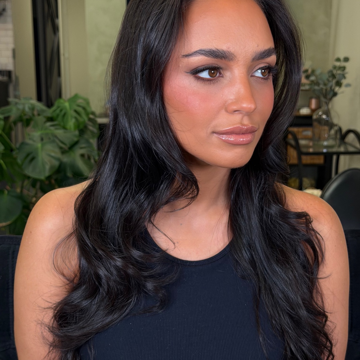 A bride finished at the vanity, soft glam and full lashes